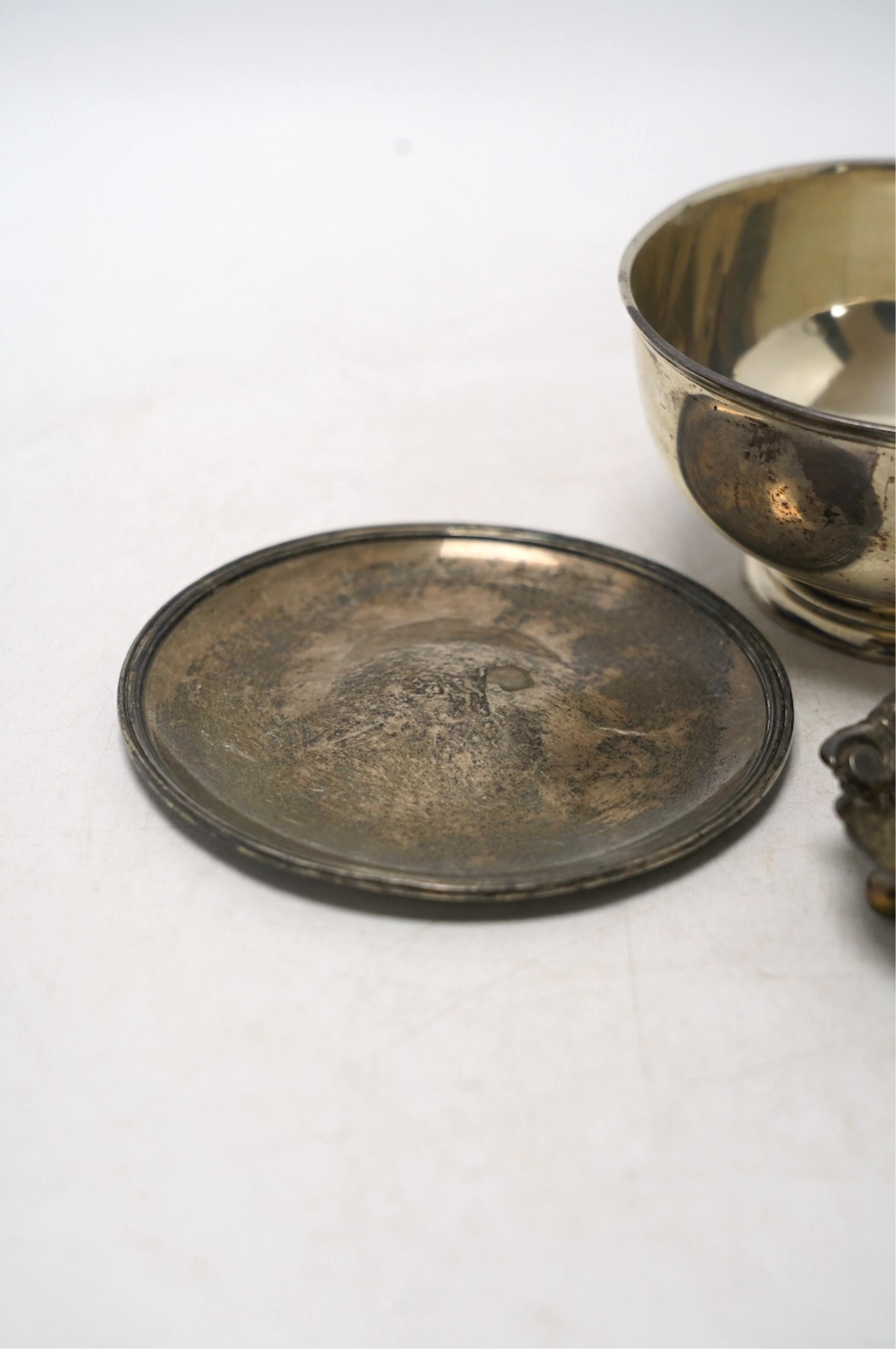 An Edwardian silver five bar toast rack, 96mm, together with a silver sugar bowl, a small silver dish and a silver shell salt, 8.3oz. Condition - fair